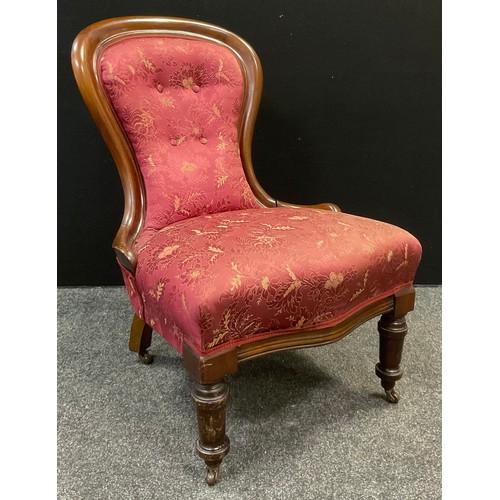 105 - A Victorian mahogany spoon back nursing chair, c.1850