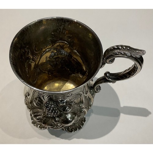 145 - A Victorian silver cup, deeply embossed with fruit including Apples, Pineapple, Grapes, George John ... 