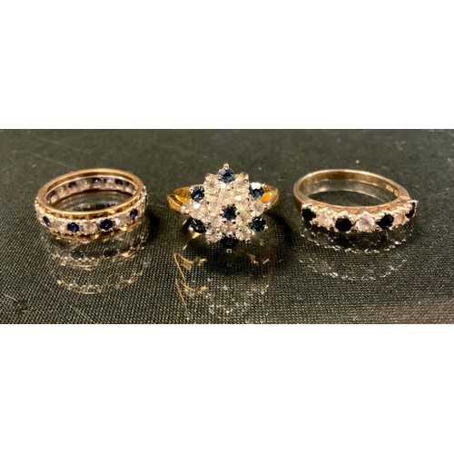 459 - A 9ct gold diamond and sapphire effect eternity ring, 3.9g gross; other CZ fashion rings, base metal... 