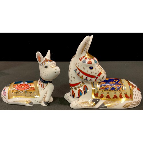 20 - A pair of Royal Crown Derby paperweights, Thistle Donkey and Holly Donkey, Goviers exclusive signatu... 