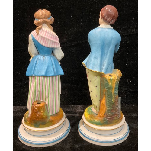 68 - A pair of 19th century French bisque figures, of a young gentleman gardener and companion, 25cm high