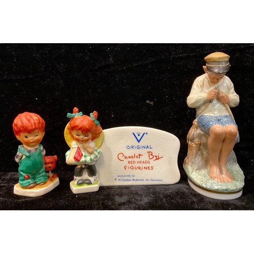 71 - A Copenhagen figure, The Whittler; a Goebel Charlot Byi figural advertising stand; another figure, T... 