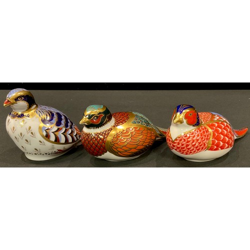 72 - A Royal Crown Derby paperweight, Pheasant, gold stopper; others, Red Legged Partridge, 21st annivers... 