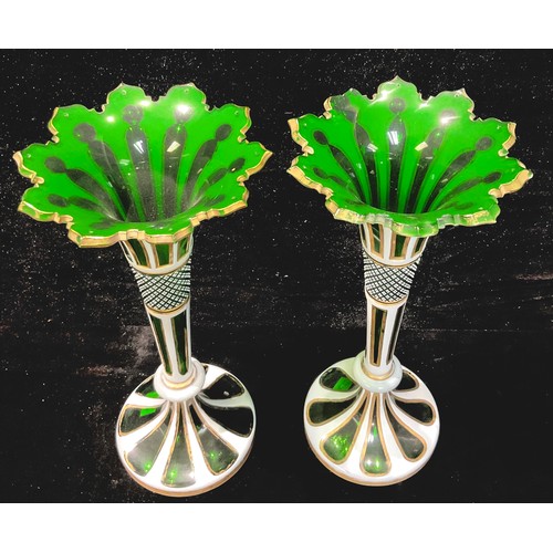 74 - A pair of 19th century Bohemian green flashed glass trumpet vases, shaped cut rim, formerly lustres,... 