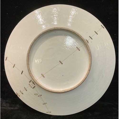 99 - A large 19th century Cantonese Famille Rose dish, 37.5cm diameter, stapled repair