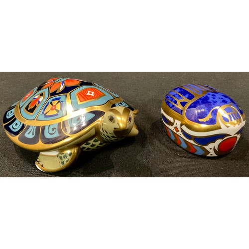 132 - A Royal Crown Derby paperweight, Terrapin, gold stopper; another, Millennium Bug, gold stopper (2)