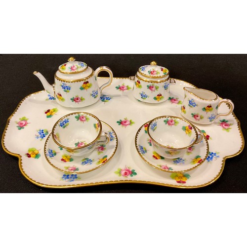 135 - A Minton miniature cabaret set on tray, comprising teapot, sucrier and cover, milk jug, pair of cups... 