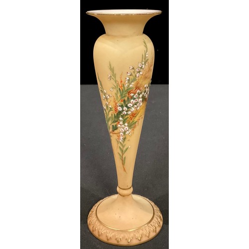 136 - A Royal Worcester blush ivory pedestal vase, painted with heathers, picked out in gilt, shape number... 