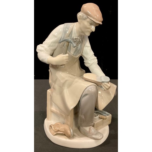 174 - A Lladro figure, The Cobbler, 24.5cm high