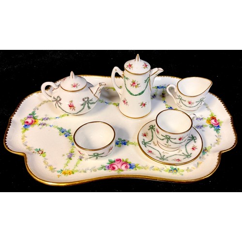 184 - A Coalport miniature cabaret set on tray, comprising teapot, hot water jug, milk jug and sugar bowl,... 