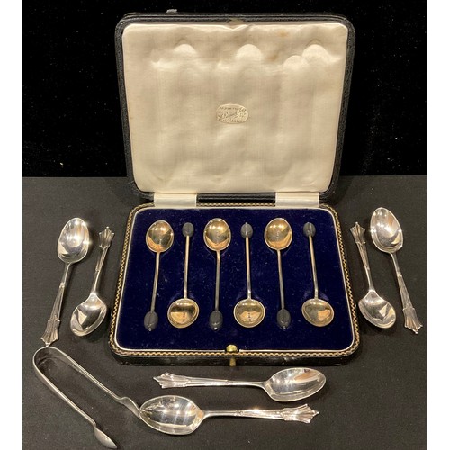 191 - A set of six silver and enamel coffee spoons, bean terminals, Birmingham 1928, cased; a set of six s... 