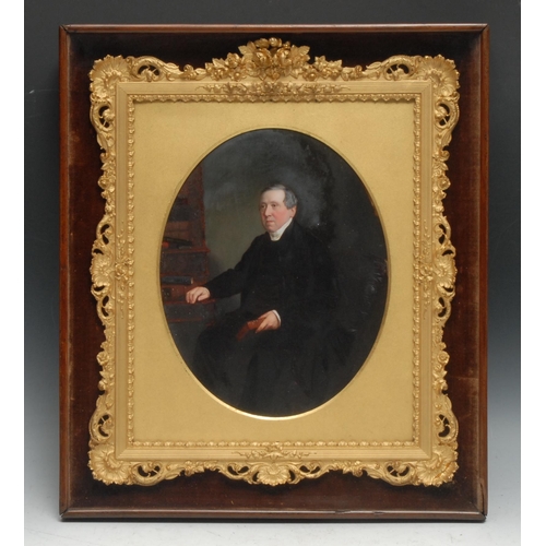 170 - A 19th century portrait, of a gentleman in his library, oval, oil on photograph, oval, 24cm x 19cm, ... 