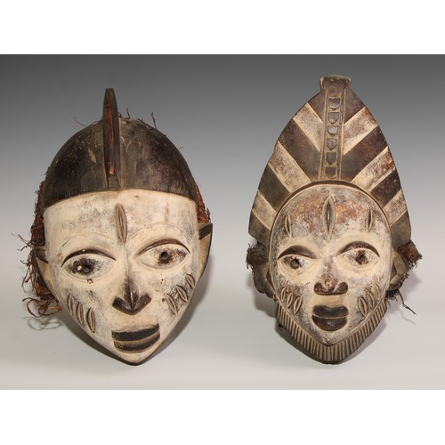 707 - Decorative Tribal Art and the Eclectic Interior - a Baule mask, lofty stylised coiffure, scarified f... 