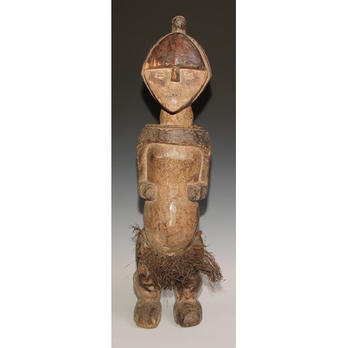 712 - Decorative Tribal Art and the Eclectic Interior - an African ancestor fetish figure, diamond shaped ... 