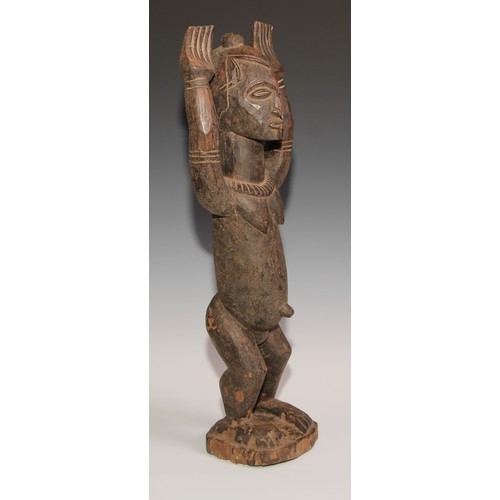 710 - Decorative Tribal Art and the Eclectic Interior - a Dogon Tellem altar figure, typically posed with ... 