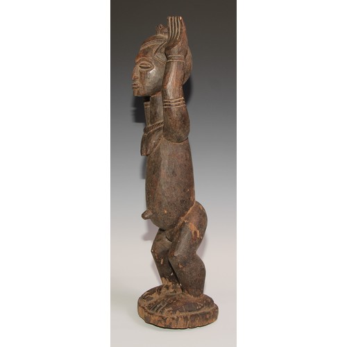 710 - Decorative Tribal Art and the Eclectic Interior - a Dogon Tellem altar figure, typically posed with ... 