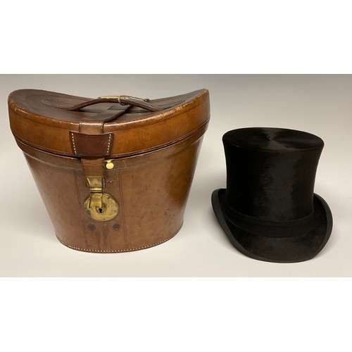 113 - A 19th century leather top hat box, brass fittings, 35cm wide, c.1880; enclosing a silk top hat, by ... 