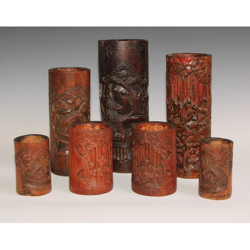 64 - A Chinese bamboo bitong brush pot, carved in the Cantonese manner with figures and blossoming prunus... 