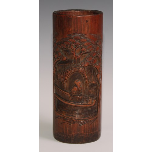 64 - A Chinese bamboo bitong brush pot, carved in the Cantonese manner with figures and blossoming prunus... 