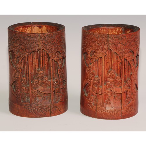 64 - A Chinese bamboo bitong brush pot, carved in the Cantonese manner with figures and blossoming prunus... 