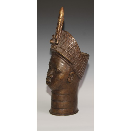 715 - Decorative Tribal Art and the Eclectic Interior- a bronze, cast as the head of an Oba or figure of t... 