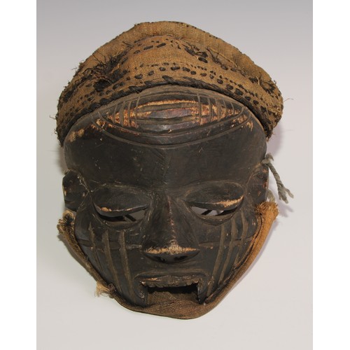 709 - Decorative Tribal Art and the Eclectic Interior - a Chokwe mask, stylised features, 25cm long, Angol... 