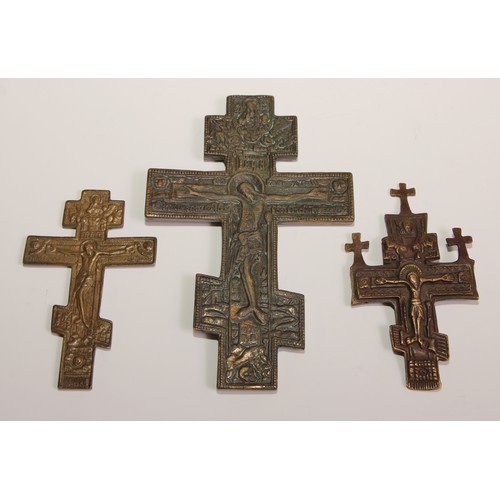 445 - A Russian Orthodox cross, of  Slavonic form, 15cm long; others (3)