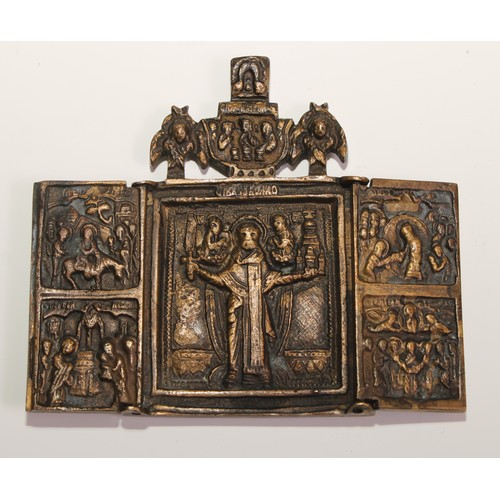 444 - A Russian Orthodox brass triptych icon, in relief with scenes from the life of St Nicholas of Mozhai... 