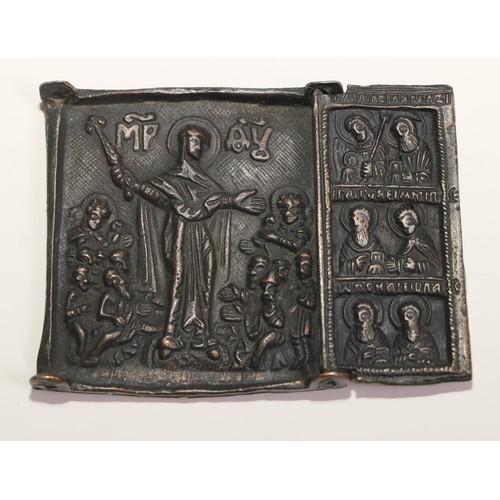 444 - A Russian Orthodox brass triptych icon, in relief with scenes from the life of St Nicholas of Mozhai... 