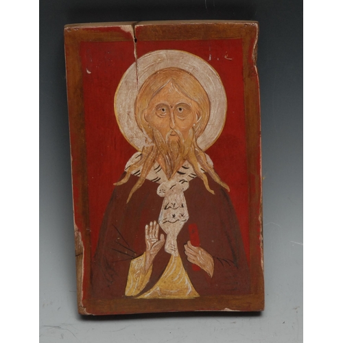 541 - An Eastern Orthodox icon, painted in polychrome with Christ, his handing making the gesture of Chi R... 