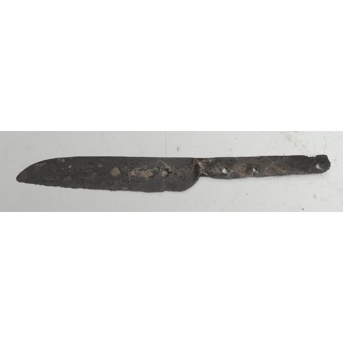 840 - Antiquities - a Viking iron axehead, 26cm long, c.12th century; two Medieval knife blades, 17.5cm an... 