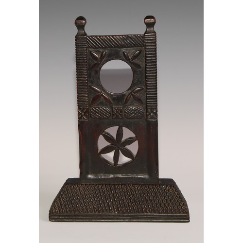 37 - A 19th century Colonial pocket watch stand, carved with stylised leaves and a pierced roundel, chequ... 