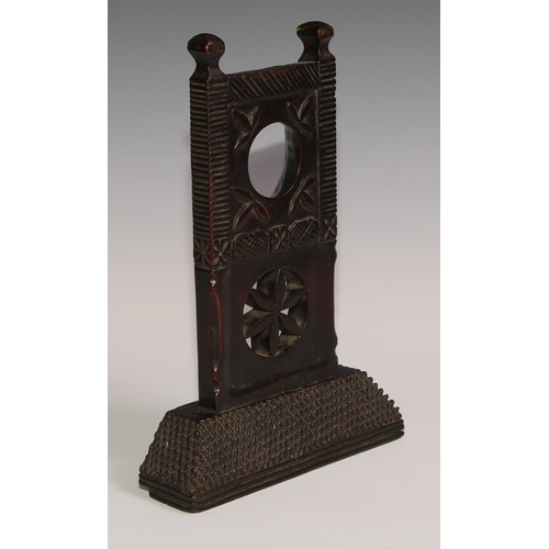 37 - A 19th century Colonial pocket watch stand, carved with stylised leaves and a pierced roundel, chequ... 