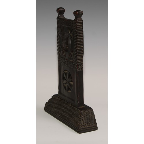 37 - A 19th century Colonial pocket watch stand, carved with stylised leaves and a pierced roundel, chequ... 