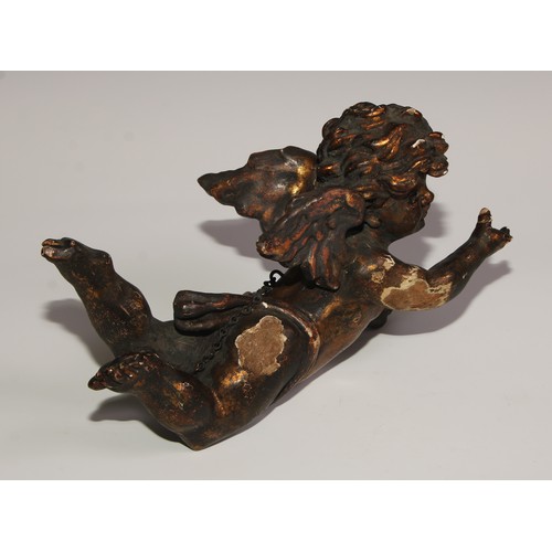 110 - A 19th century Italian carved limewood putto, 28cm wide