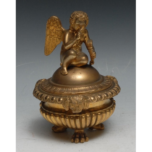 440 - A Regency design gilt bronze half-fluted tripod inkwell, domed cover crested by a putto, egg-and-dar... 