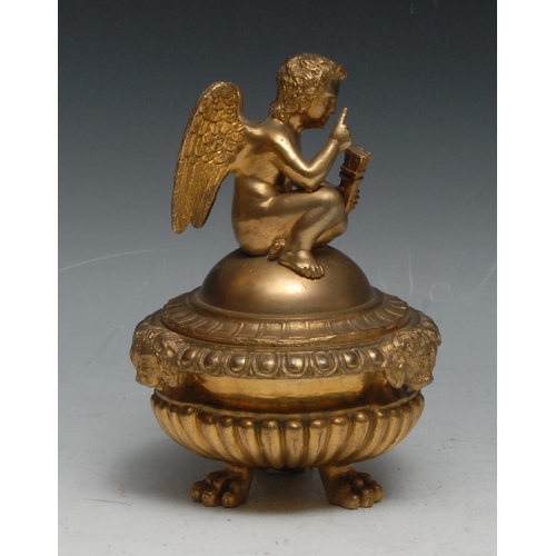 440 - A Regency design gilt bronze half-fluted tripod inkwell, domed cover crested by a putto, egg-and-dar... 