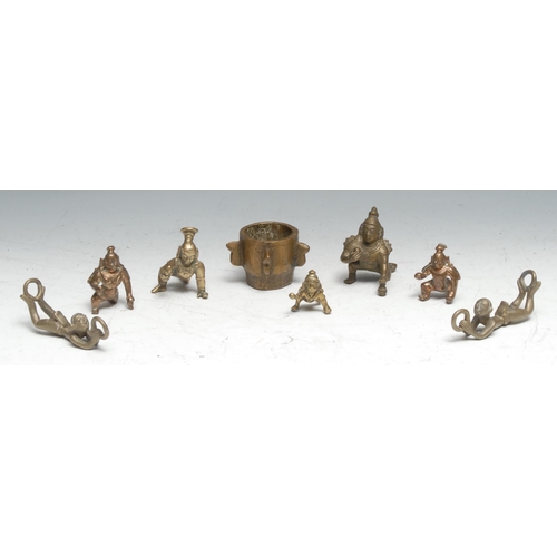 123 - A collection of Indian bronze and base metal domestic shrine murti, cast as the infant Krishna, etc;... 