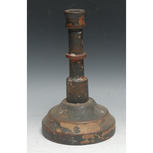 249 - Treen - a turned and painted softwood candlestick, 25.5cm high