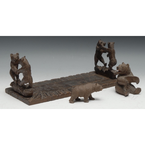 55 - A Black Forest carved wooden book slide, the ends carved with  two fighting bears, 34cm closed, c.18... 