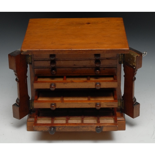 264 - A 19th century table top collector's chest, of architectural design and Wellington form, oversailing... 