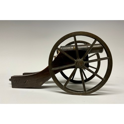 282 - A bronze library model signalling cannon, 13cm barrel with live touch-hole, the oak carriage with br... 