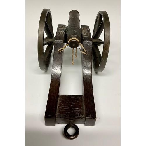 282 - A bronze library model signalling cannon, 13cm barrel with live touch-hole, the oak carriage with br... 