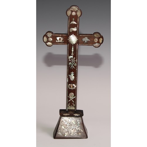 290 - A Chinese hardwood and mother of pearl cross,  inlaid with foliage and symbols, 30.5cm high