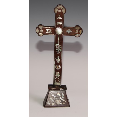 290 - A Chinese hardwood and mother of pearl cross,  inlaid with foliage and symbols, 30.5cm high