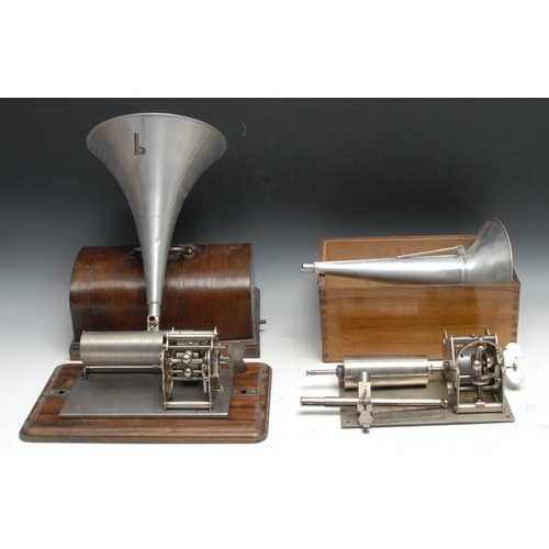 785 - An early 20th century cylinder phonograph, serial no. 27203,  domed cover, 32cm wide;  another;  two... 