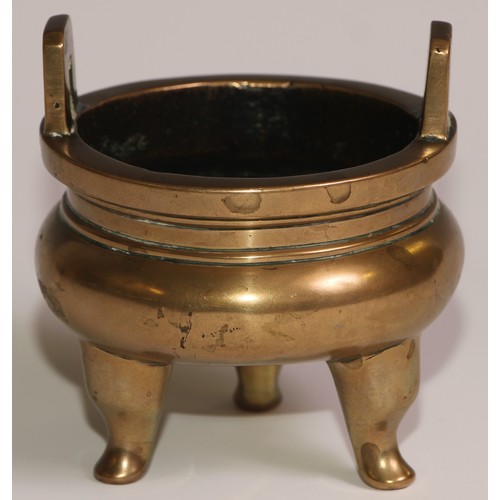 68 - A Chinese bronze ding tripod censer, angular lug handles, 8.5cm wide