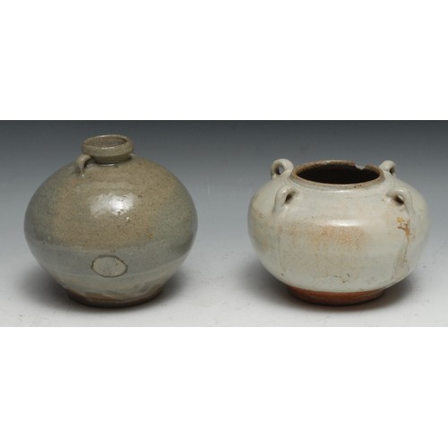 121 - A Chinese celadon wine jar, of Archaic form, four lug handles, 16cm diam; another (2)