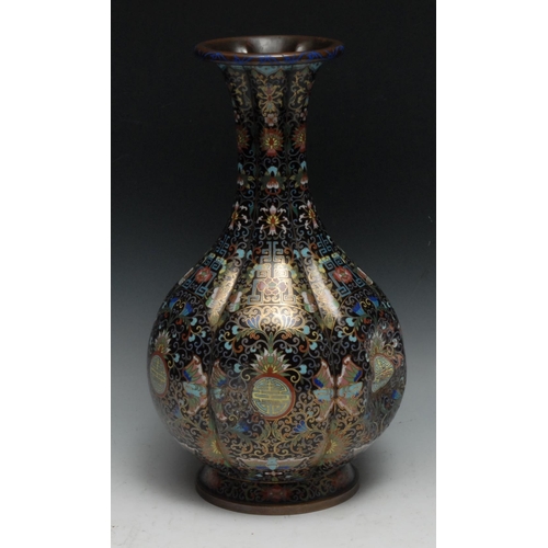 286 - A Chinese cloisonne enamel fluted ovoid vase, decorated in polychrome with shou, butterflies, flower... 