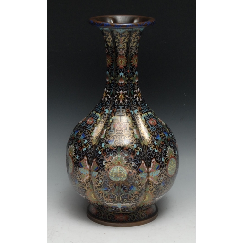 286 - A Chinese cloisonne enamel fluted ovoid vase, decorated in polychrome with shou, butterflies, flower... 